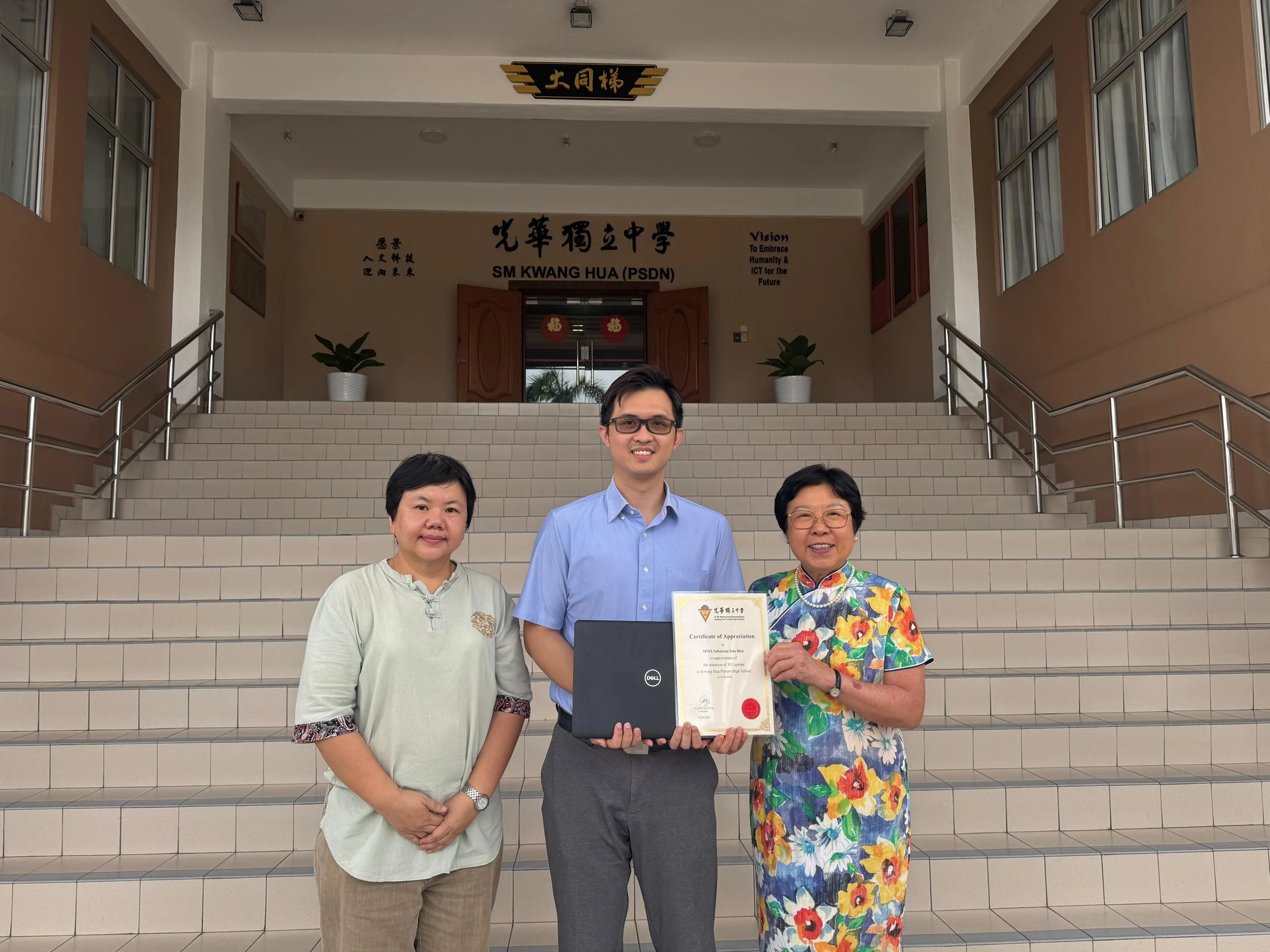 MMX Solutions Director Raymond Tiew with Ms Lim from the IT Department and Principal Madam Seah during the Kwang Hua laptop donation handover