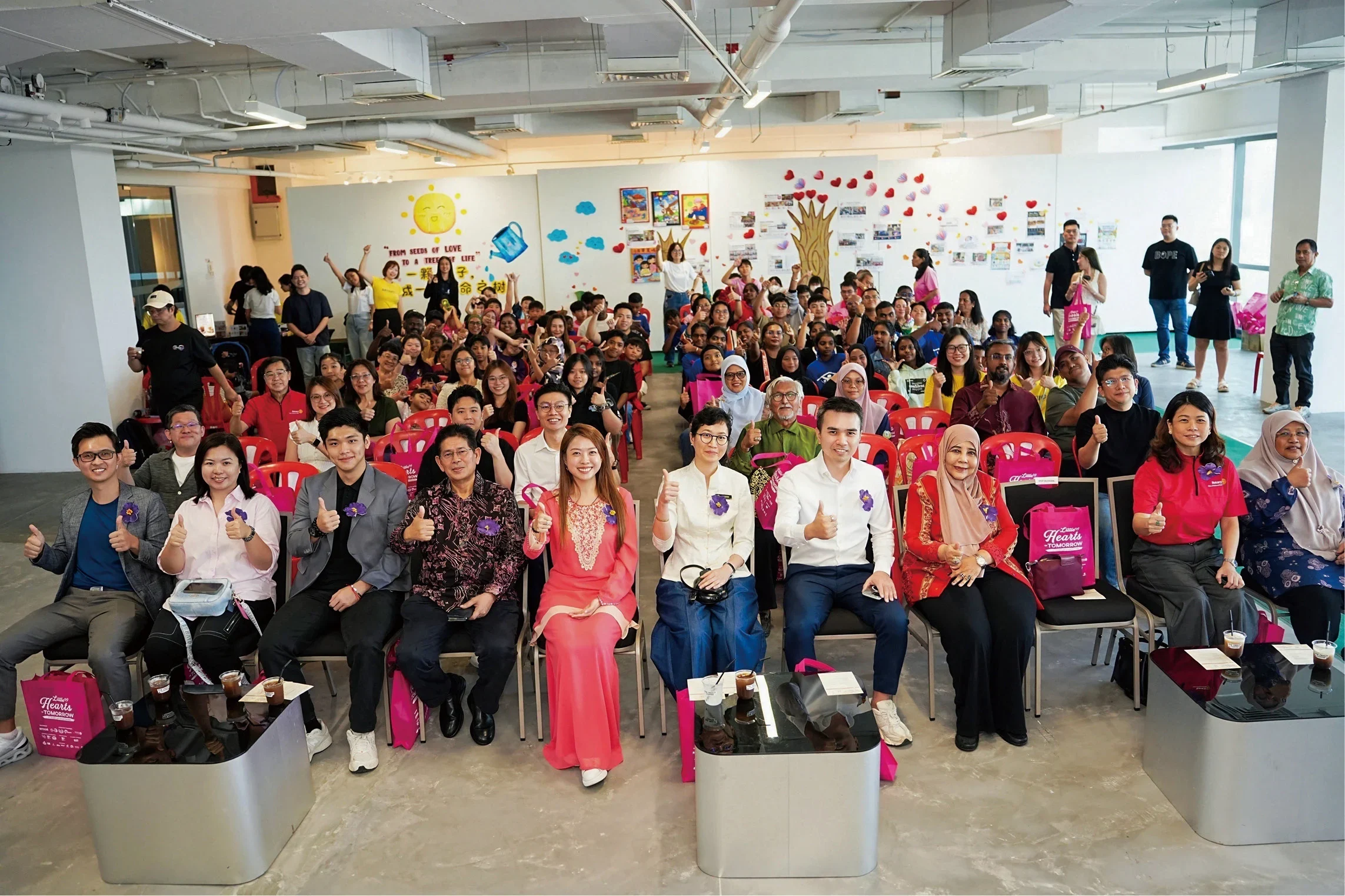 Group photo of the Directors, organizers, partners, and participants involved at the Little Heart of Tomorrow 2026 charity art exhibition.
